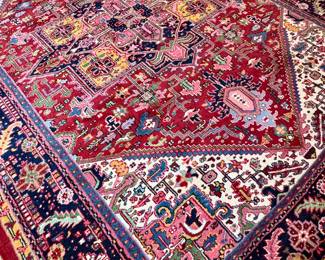 $1600; wool, knotted rug with vibrant red, blue, gold and pinks; 9'x11'