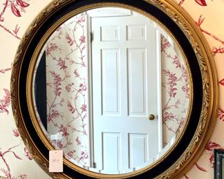 $200; black and gold round mirror; 30"d