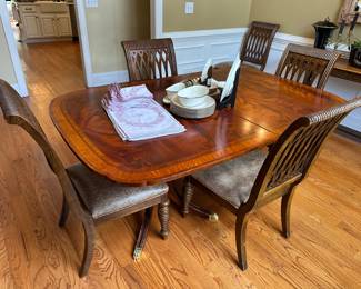 Vintage twin pedestal mahogany banded extending dining table with additional leaf