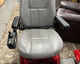Two motorized mobility scooters