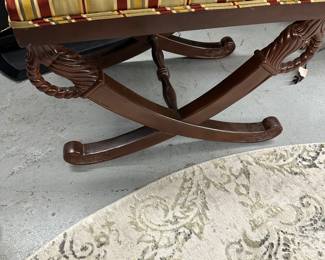 Footrest with carved sword legs