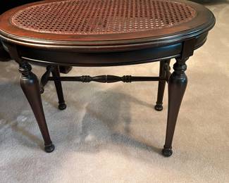 Caned top table with turned stretcher base