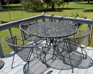 #65 Wrought iron table with 4 chairs $125.00