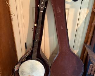 #49 Harmony Banjo with case $125.00