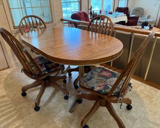 #55 Table with 4 rolling chairs with 1 leaf 48-60x36x29.5 $100.00