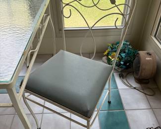 #59 Vintage glass top table with 4 chairs 42x28x29 $100.00