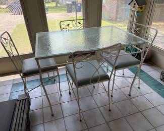 #59 Vintage glass top table with 4 chairs 42x28x29 $100.00