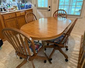 #55 Table with 4 rolling chairs with 1 leaf 48-60x36x29.5 $100.00