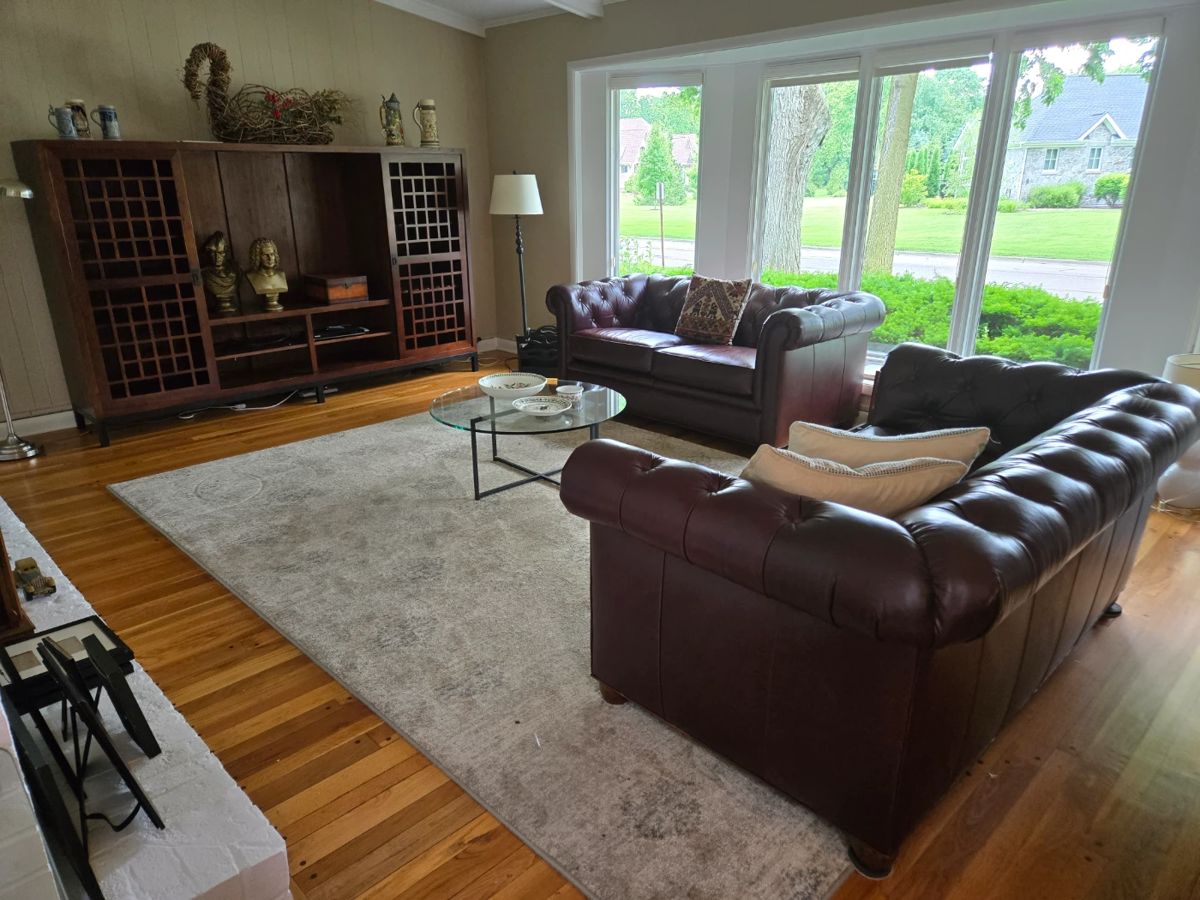 Pair of matching leather Pottery Barn chesterfield sofas and a beautiful entertainment cabinet with sliding doors