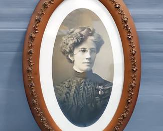Framed Portrait Of Woman In Oval Floral Frame