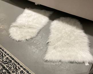 Two white rugs