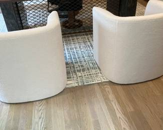 Beige upholstered club chairs from the back