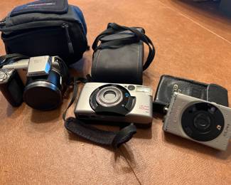 Olympus Digital, Cannon Sure Shot, and Cannon ELPH Cameras