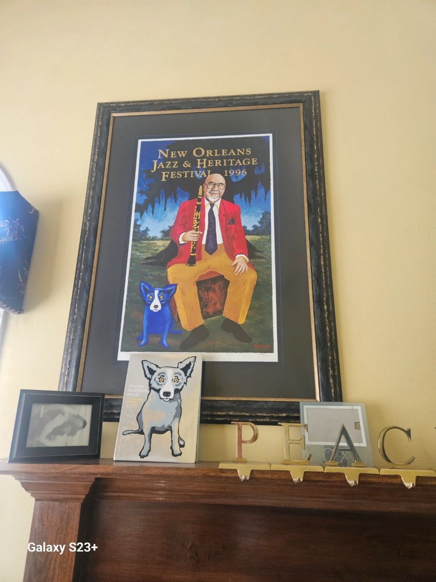 Many Blue Dog framed prints in home.