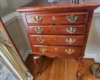 Located in dining room. Silverware chest. each drawer accommodates your siver ware and serving pieces.