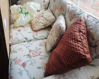 Formal room sofa includes pillows