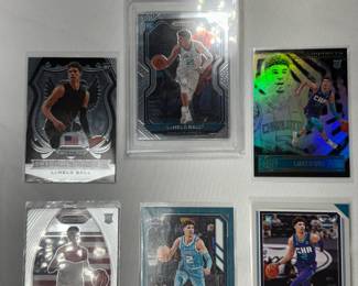 4 UNGRADED, AND ONE GRADED LAMELO BALL BASKETBALL CARDS