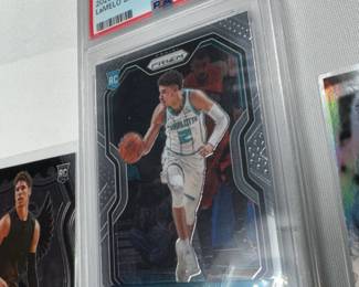 4 UNGRADED, AND ONE GRADED LAMELO BALL BASKETBALL CARDS