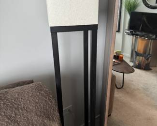 black, lacquered floor lamp