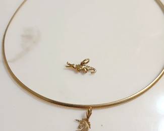 14kt gold necklace with multiple pendants.