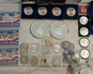 Huge assortment of peace dollars , morgan dollars , walking liberty (halves and heavier bullion .999 copies) and much much more.