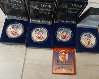 Painted silver american eagle coins (various dates).