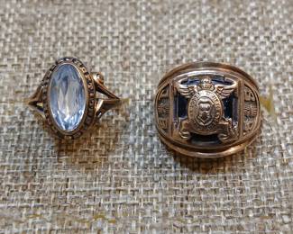 Heavy gold graduate rings.