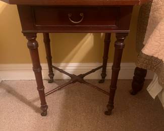 Petite side table, brass casters