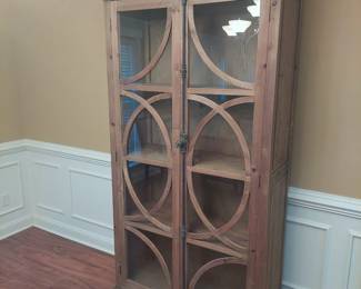 bookcase or curio cabinet-your call. It doesn't look as if it's ever been used.