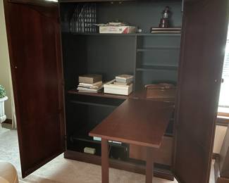 Cabinet that folds out to a desk
