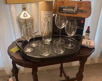 Vintage oval side table, elegant crystal Bordeaux wine glasses