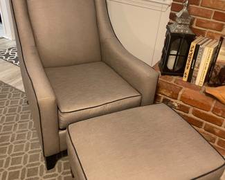 Bassett occasional gray fabric chair with tapered legs capped in metal ferrules.