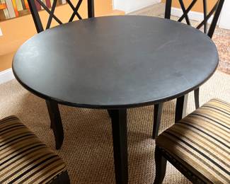 Small round black table with four Upholstered chairs