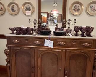 Lenox china on wall, Antique buffet and mirror, and plum dishes.