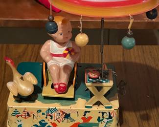 Tin Lithographed Windup Toy “Happy Life” Girl on Beach