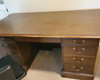 Boling Desk! Characteristics: well-made with a over the edge top that adds more spacing. The top is deep and the bottom two drawers on the left made a filing drawer. In good shape.