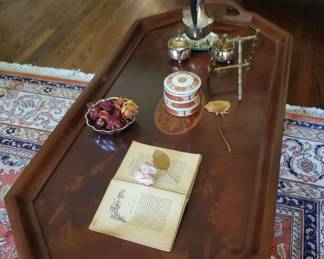 This table is remarkable. Notice the inlaid centerpiece, the shape of the top and grain of the wood, the edging on the top, and the legs! Oh, my!