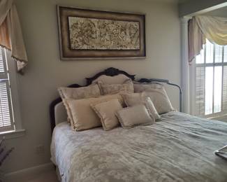 There are fantastic beds in this home. With a Louis XV, upholstered head board which drops low. The frames and mattress are superb with a remote. The spread, dust ruffle, headboard, several pillows --all are custom made and all in the same family of color/patterns. The drapes are for sell as well. Bed, mattress, spread, etc., are one price.