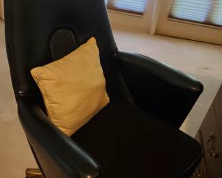 Leather desk chair with brass protectors on legs. Sturdy!