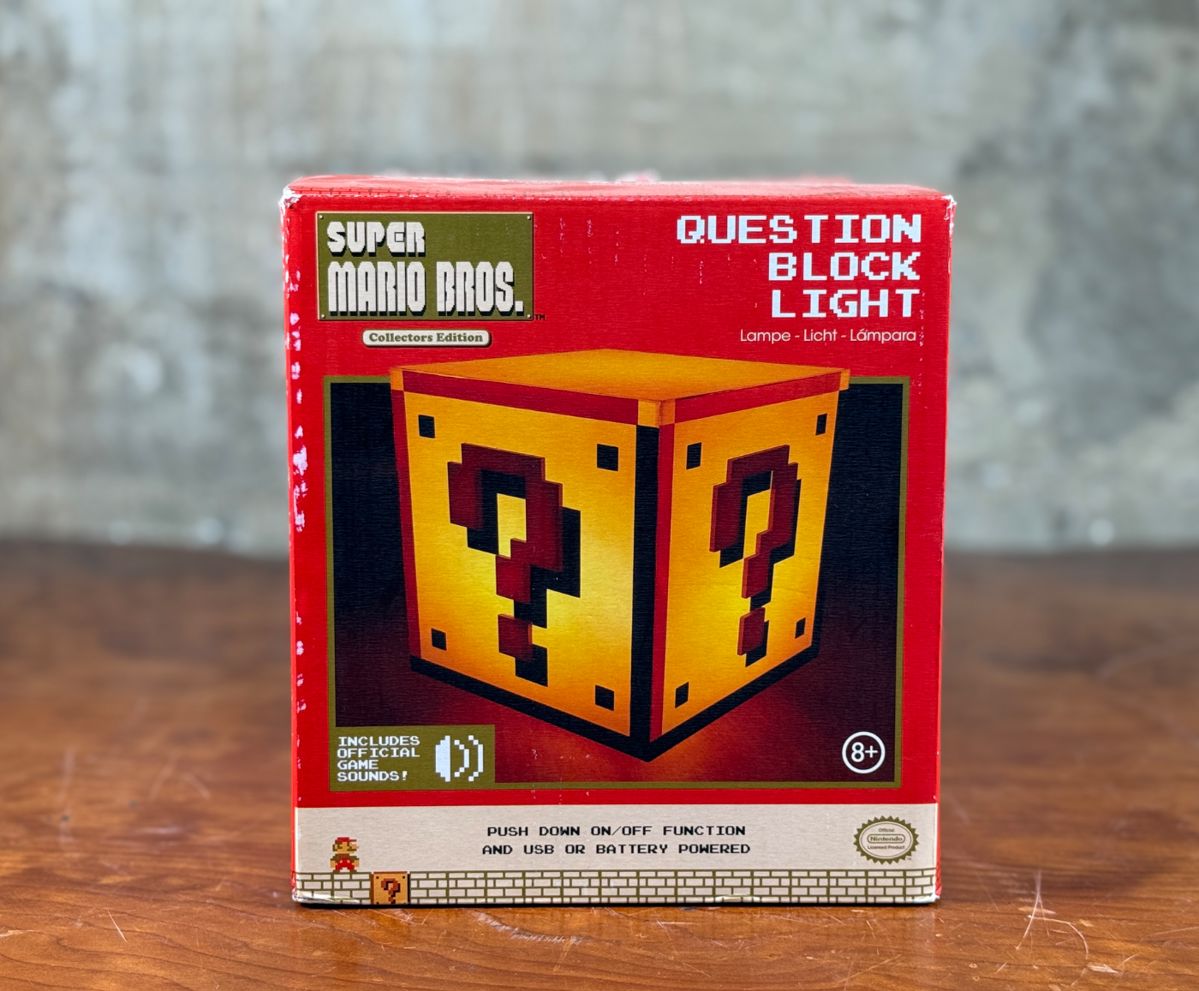 This lot features a new old stock “Question Block Light” by Nintendo. Appears to have never been taken out of the box. Comes untested.