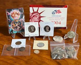 This lot features an assortment of collectible coins including a limited edition copper piece, buffalo nickels, dime & quarter proofs, a full silver proof set from 2004, and more.