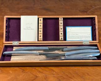 This lot features a vintage Gerber hand-made knife set. One blade appears to be broken, and the rest are in good condition.