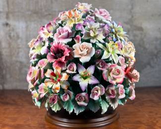 This lot features a large floral arrangement center piece, manufactured by Capodimonte. This large arrangement measures, 16” H x 14” W x 14” D. Capodimonte porcelain, soft-paste porcelain produced by a factory established in 1743 at the Palazzo of Capodimonte by Charles III of Naples. Ware was produced there in large quantity and wide variety until 1759, when the concern was dismantled and removed to Buen Retiro, near Madrid, when Charles became king of Spain. This item appears to be in very good condition. No in-house shipping available.