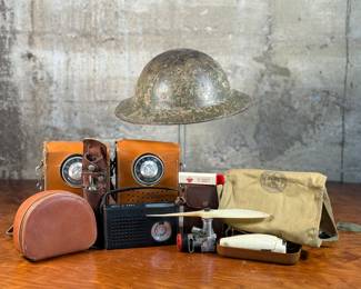 This lot features a large assortment of collectibles, primarily military or Boy Scout related.