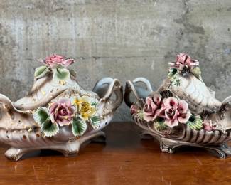 This lot features a pair of Capodimonte covered footed vessels. Each item measures (with the lid), 11” H x 17” W x 10” D. Capodimonte porcelain, soft-paste porcelain produced by a factory established in 1743 at the Palazzo of Capodimonte by Charles III of Naples. Ware was produced there in large quantity and wide variety until 1759, when the concern was dismantled and removed to Buen Retiro, near Madrid, when Charles became king of Spain. No in-house shipping available. Some minor flaws throughout each vessel.
