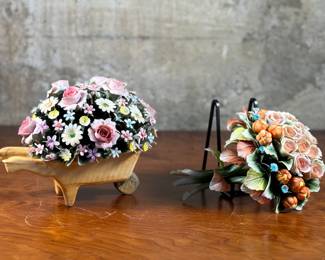 This lot features a Capodimonte porcelain wheelbarrow sculpture & a flower sconce. Capodimonte porcelain, soft-paste porcelain produced by a factory established in 1743 at the Palazzo of Capodimonte by Charles III of Naples. Ware was produced there in large quantity and wide variety until 1759, when the concern was dismantled and removed to Buen Retiro, near Madrid, when Charles became king of Spain. This item appears to be in very good condition. No in-house shipping available.