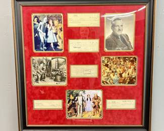 The Wizard Of Oz Autographed Ephemera Display Of Photos, Checks, and Contracts Signed By 15 Cast Members With Letter Of Authenticity
Signatures include: Judy Garland, Jack Haley, Raymond W. Bolger, Bert Lahr, Billie Burke, Frank Morgan, Margaret Hamilton, and 8 of the Munchkins
Measures: 37.5" x 36.5"