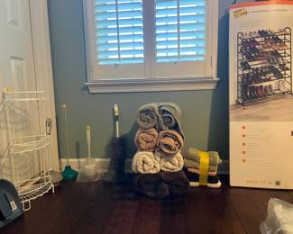shoe racks, towels and bedding, bathroom items +