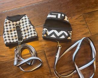 Two small pet harnesses and leashes