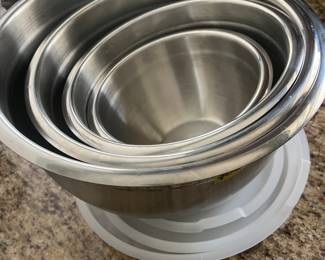 Set of four stainless steel bowls, with grip bottoms, lids, and substantial metal